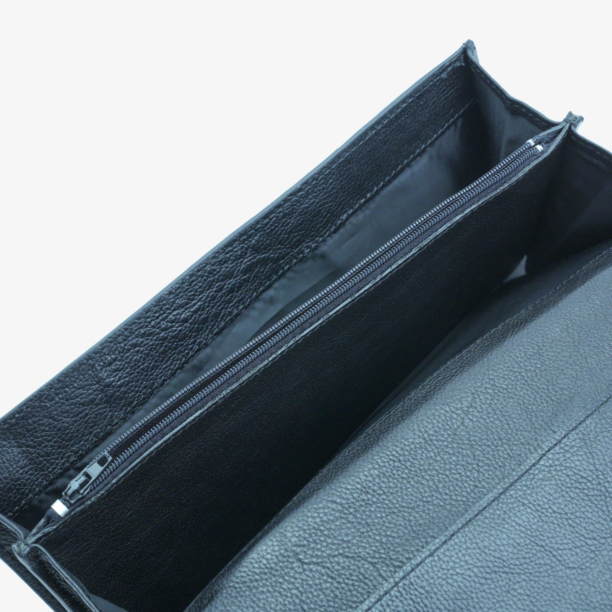 Black leather clutch with three main compartments, one zip pocket, and three card pockets for organized storage