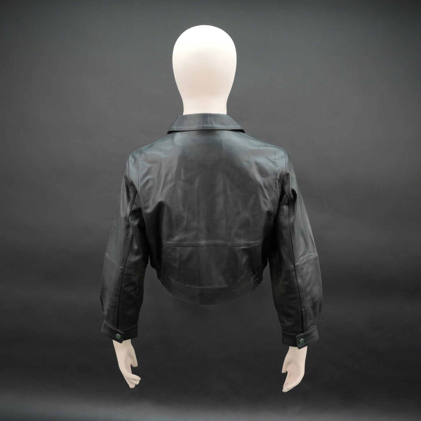 Women black cropped leather jacket with ribbed hem and side pockets
