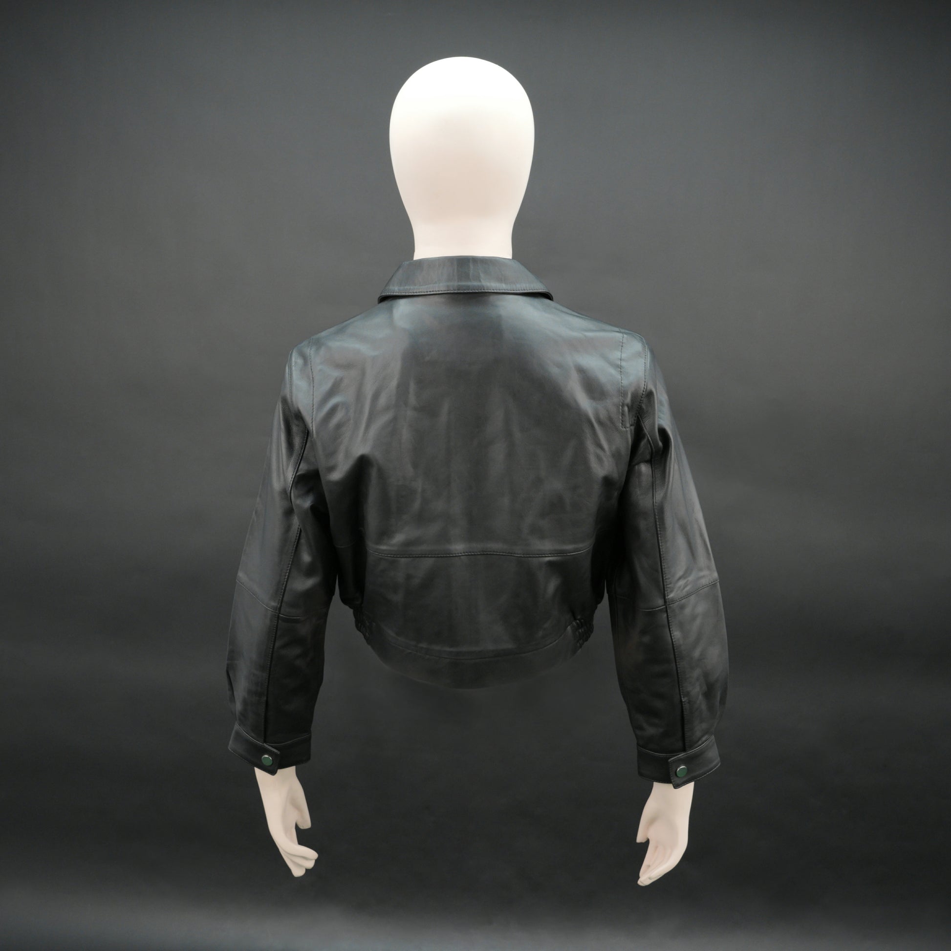 Women black cropped leather jacket with ribbed hem and side pockets