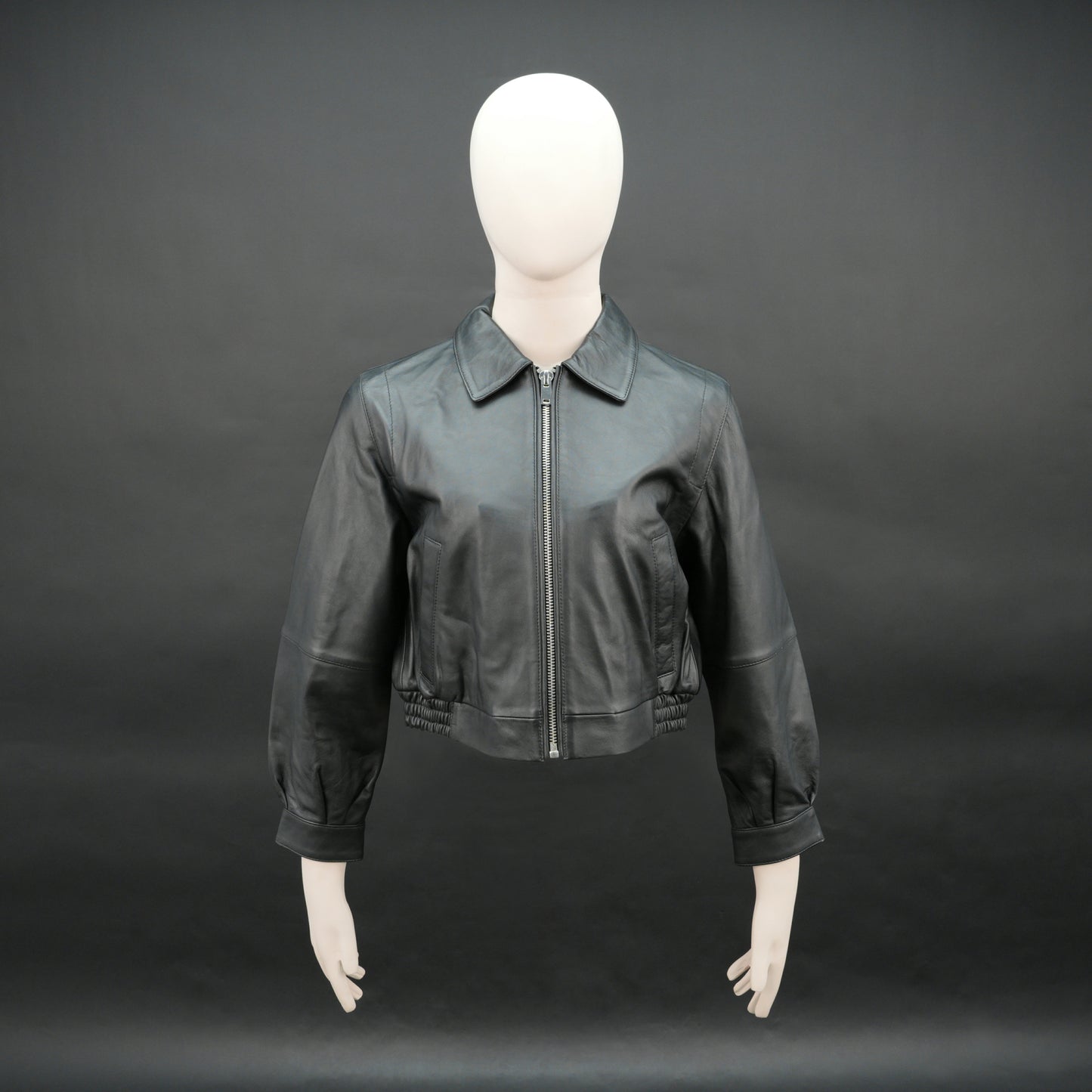 Women black cropped leather jacket with ribbed hem and side pockets