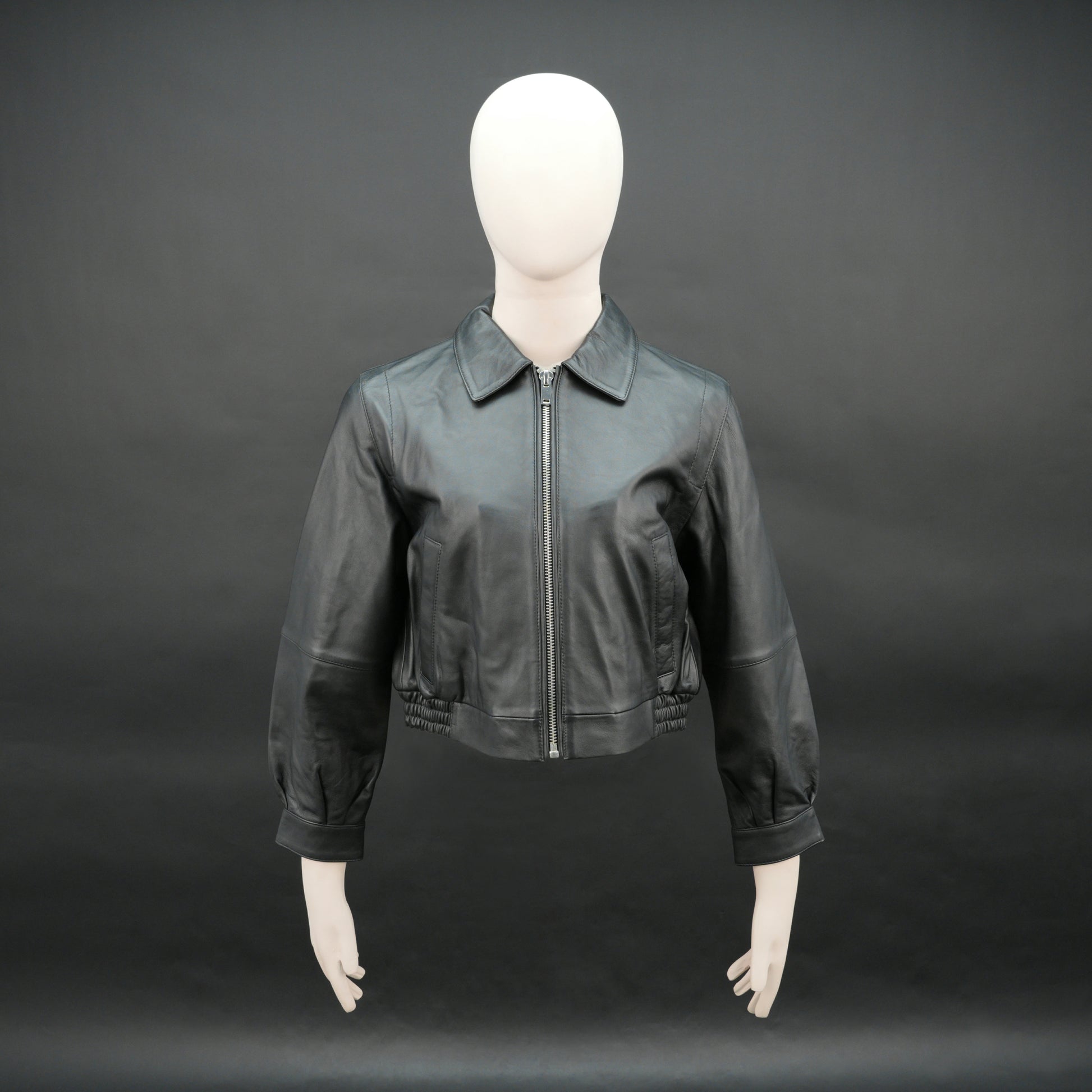 Women black cropped leather jacket with ribbed hem and side pockets