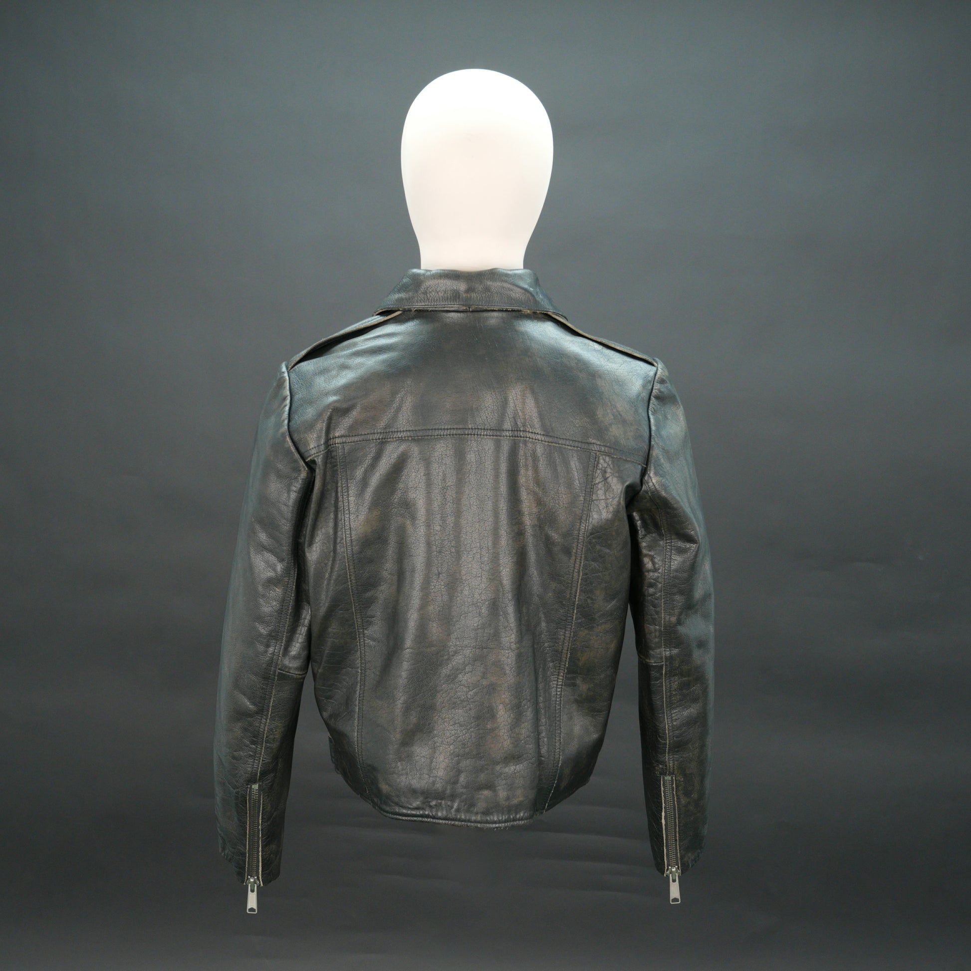 Black leather moto jacket with asymmetric zip and slim fit.