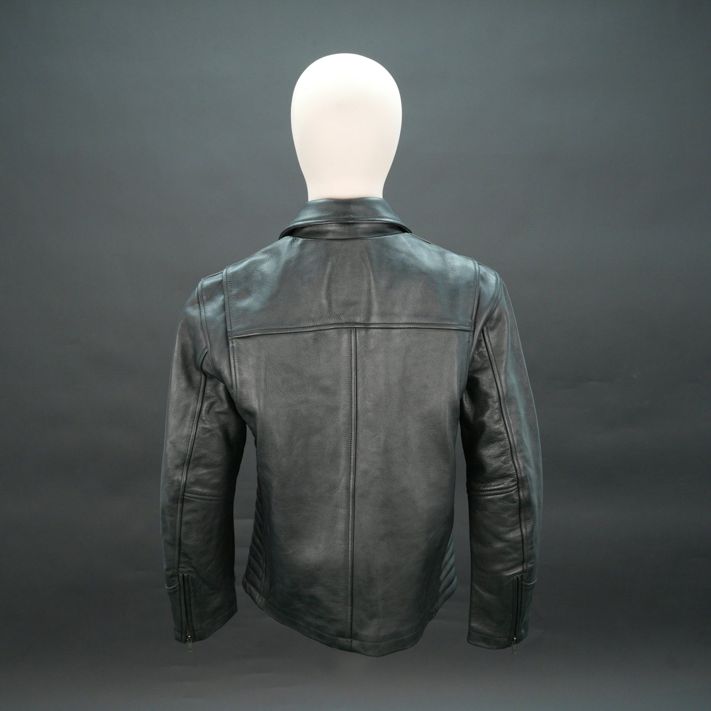 Black leather biker jacket with quilted design, slim fit, and zip closure.