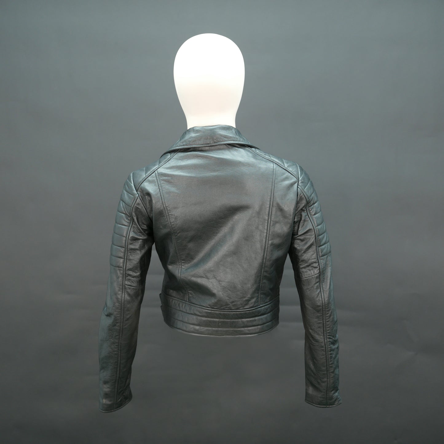 Black leather biker jacket with lapel collar and asymmetrical zip.