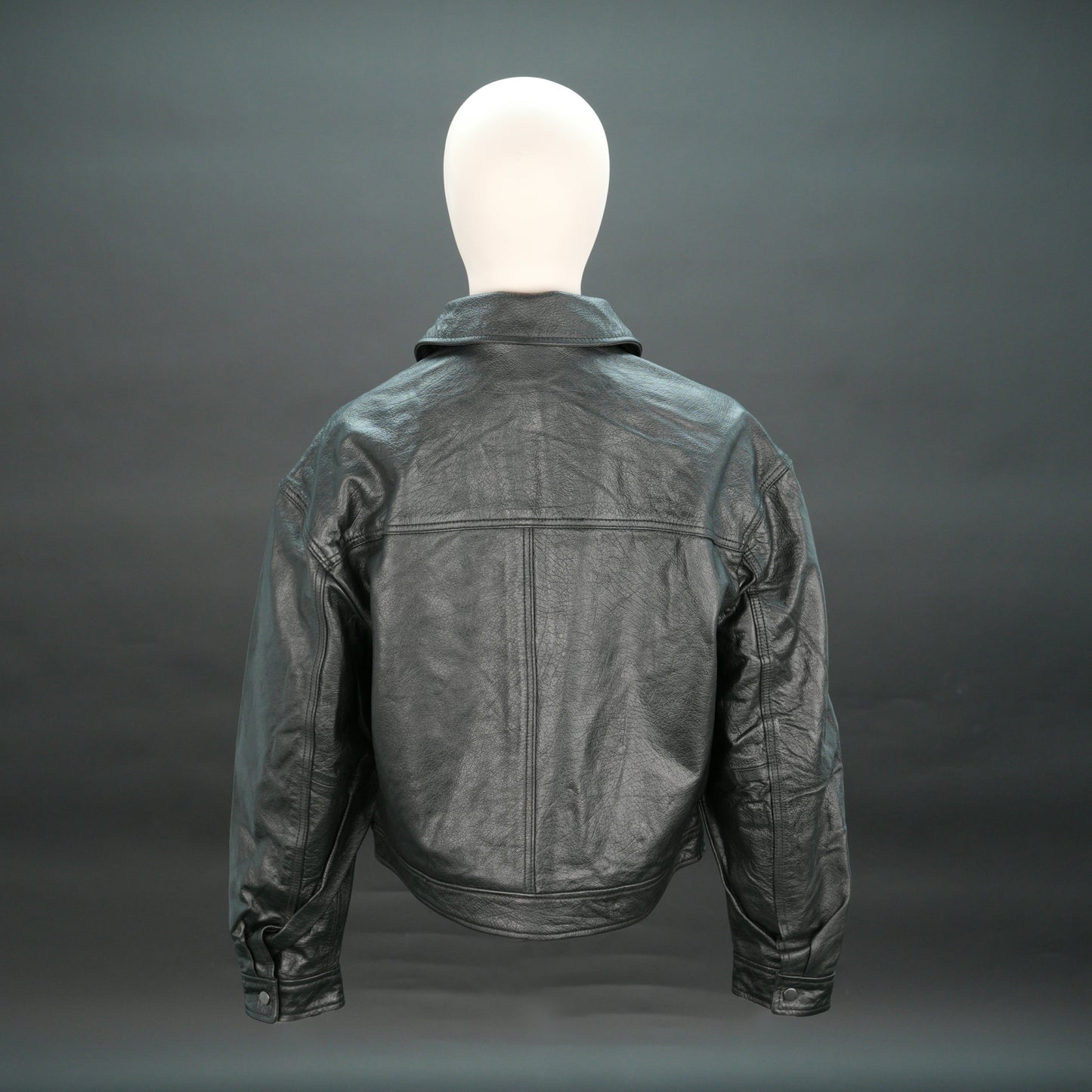 Women black leather trucker jacket with shirt collar and button closure