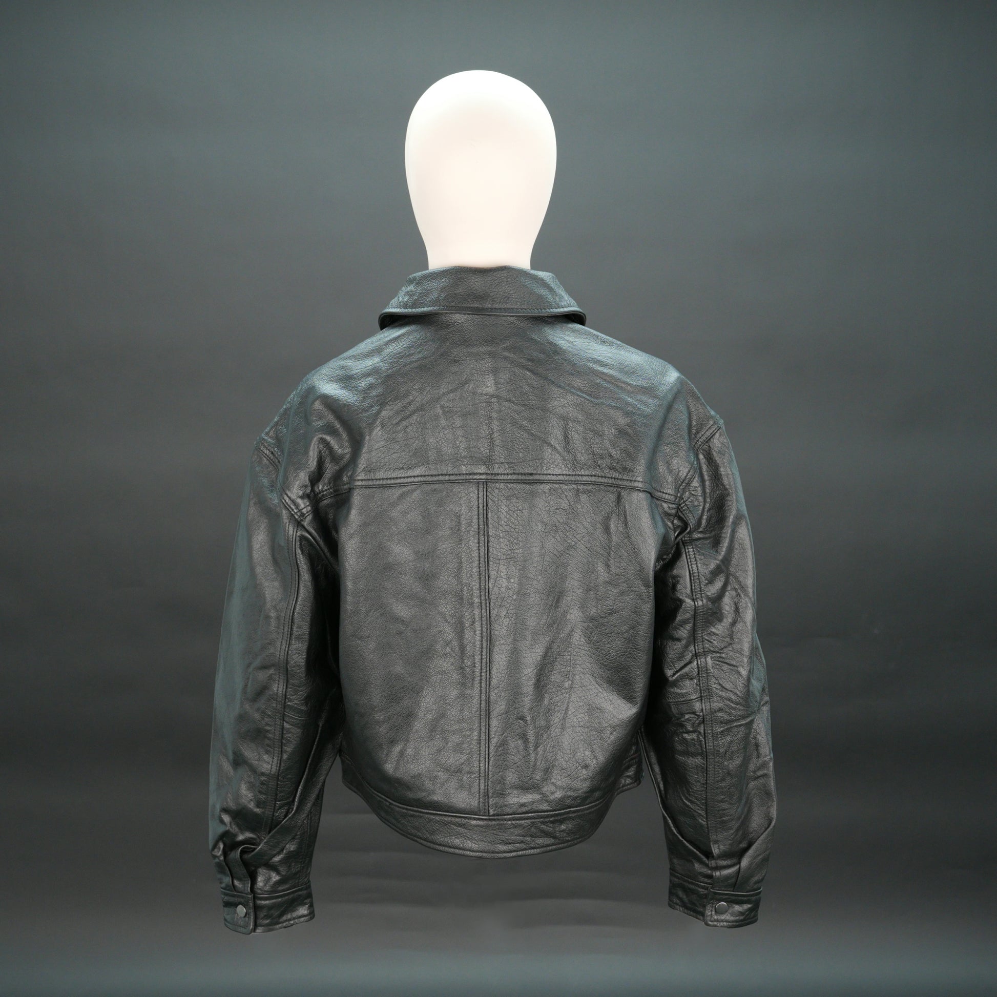 Women black leather trucker jacket with shirt collar and button closure