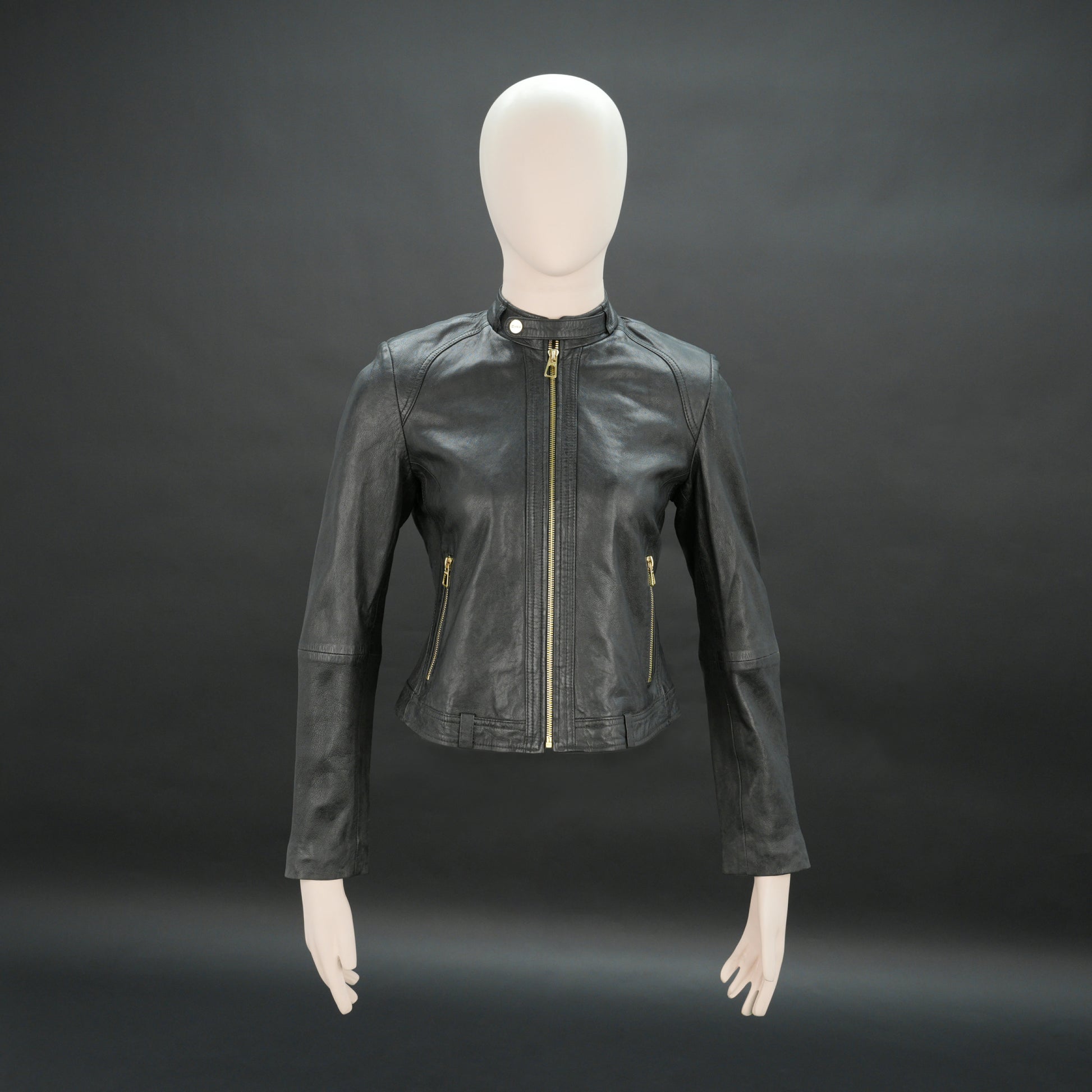 Women black biker leather jacket with gold zip pockets and tailored fit