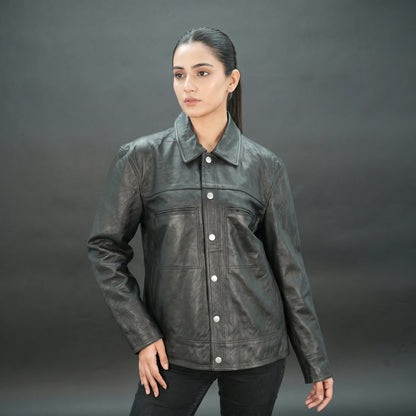 Black leather jacket with spread collar, button closure, and relaxed fit.