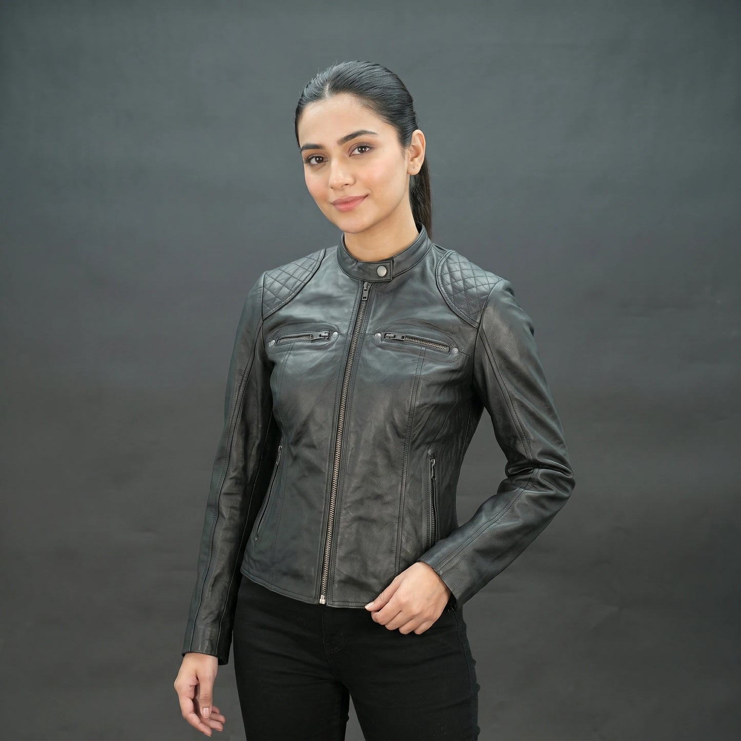 Black lambskin leather biker jacket with quilted shoulders.
