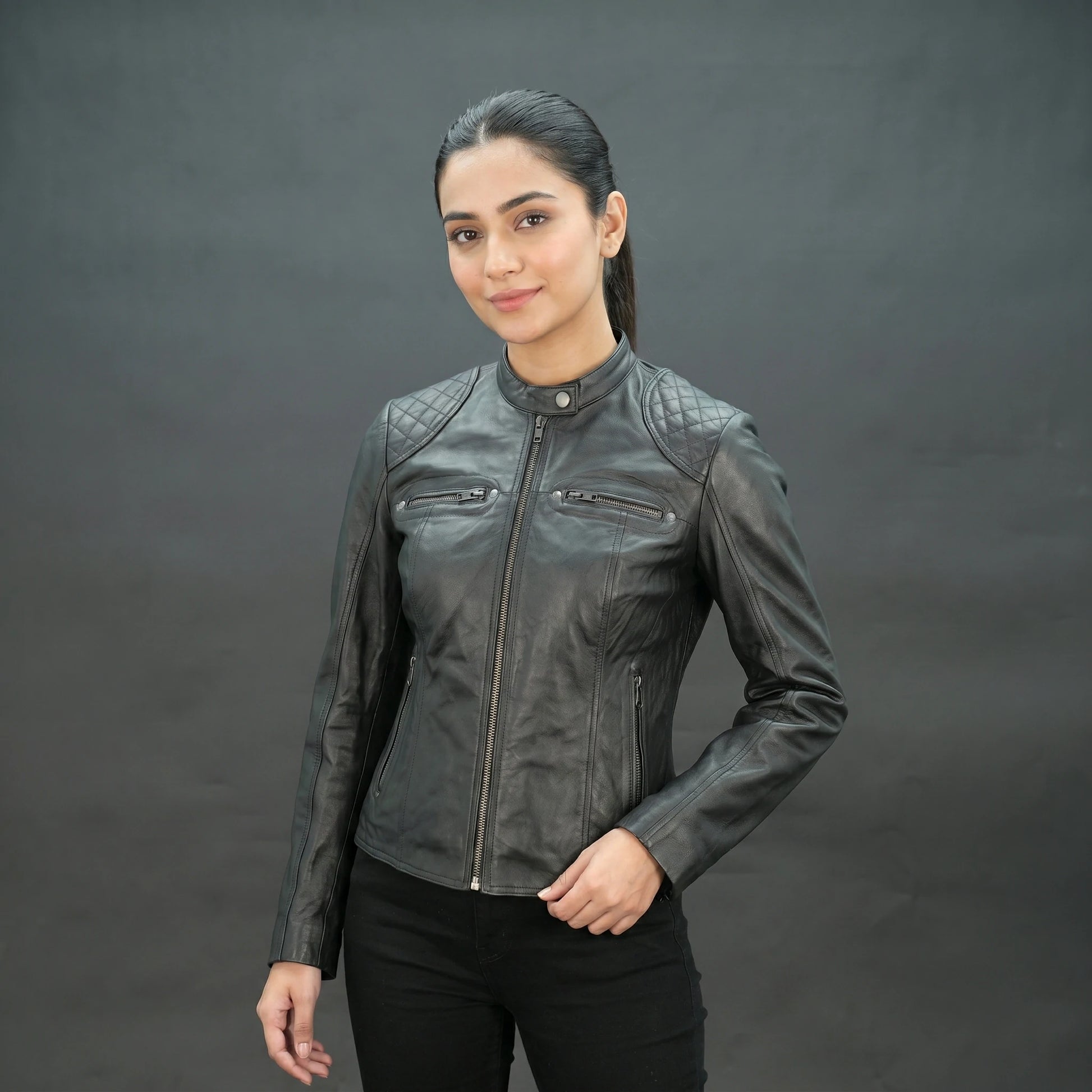 Black lambskin leather biker jacket with quilted shoulders.