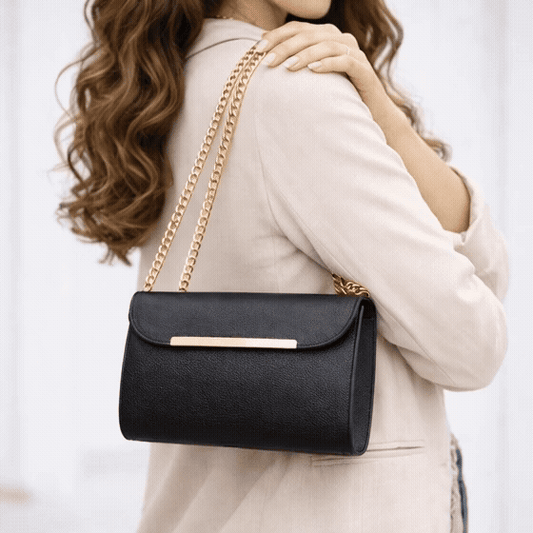 Classic black leather crossbody bag with long chain strap and two open pockets—stylish, durable, and perfect for both casual and formal occasions.