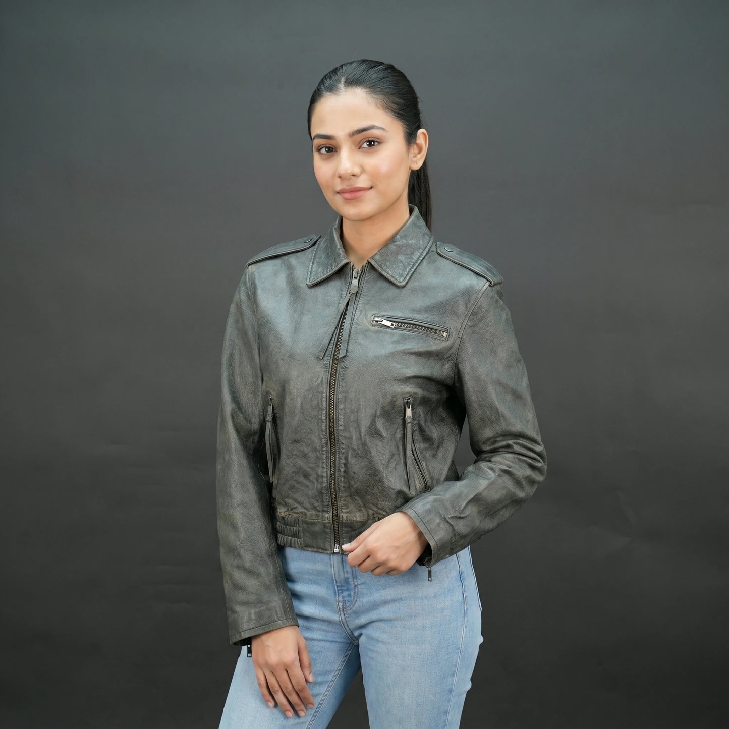 Grey distressed leather biker jacket with slim fit and lapel collar.