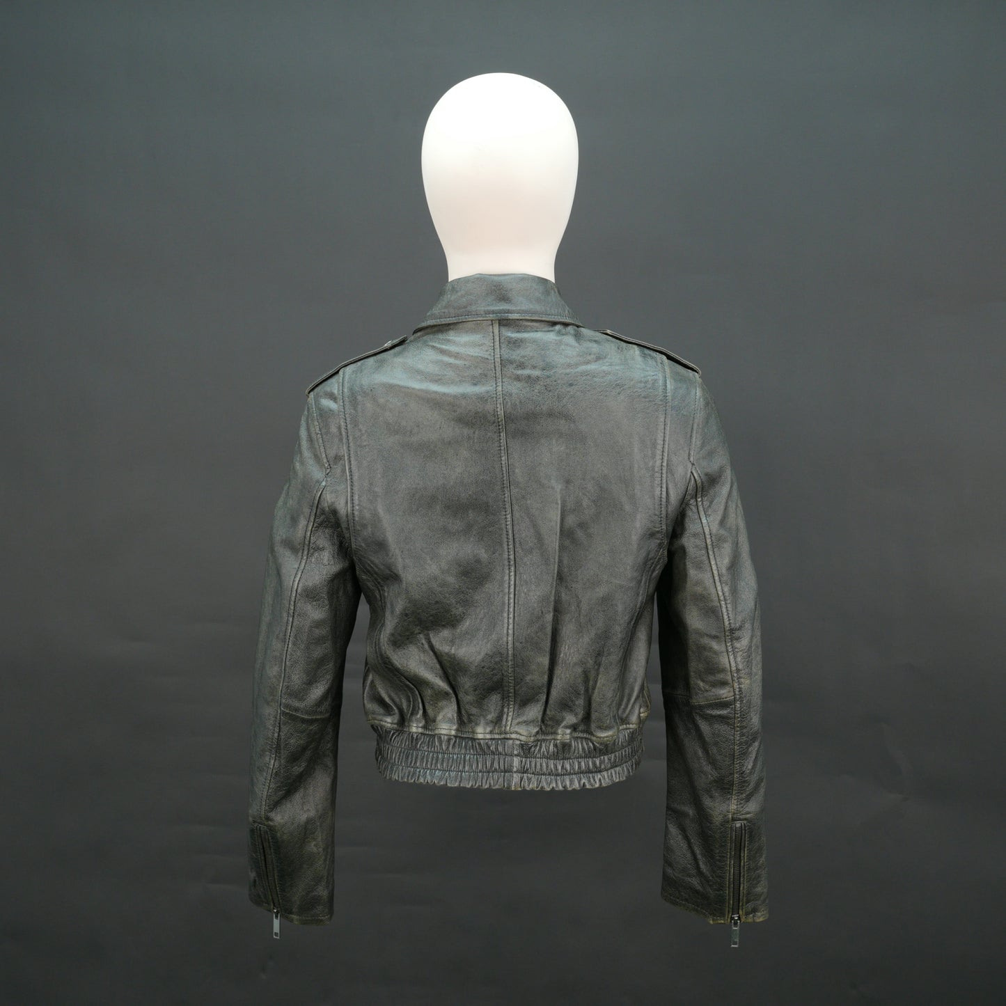 Grey distressed leather biker jacket with slim fit and lapel collar.