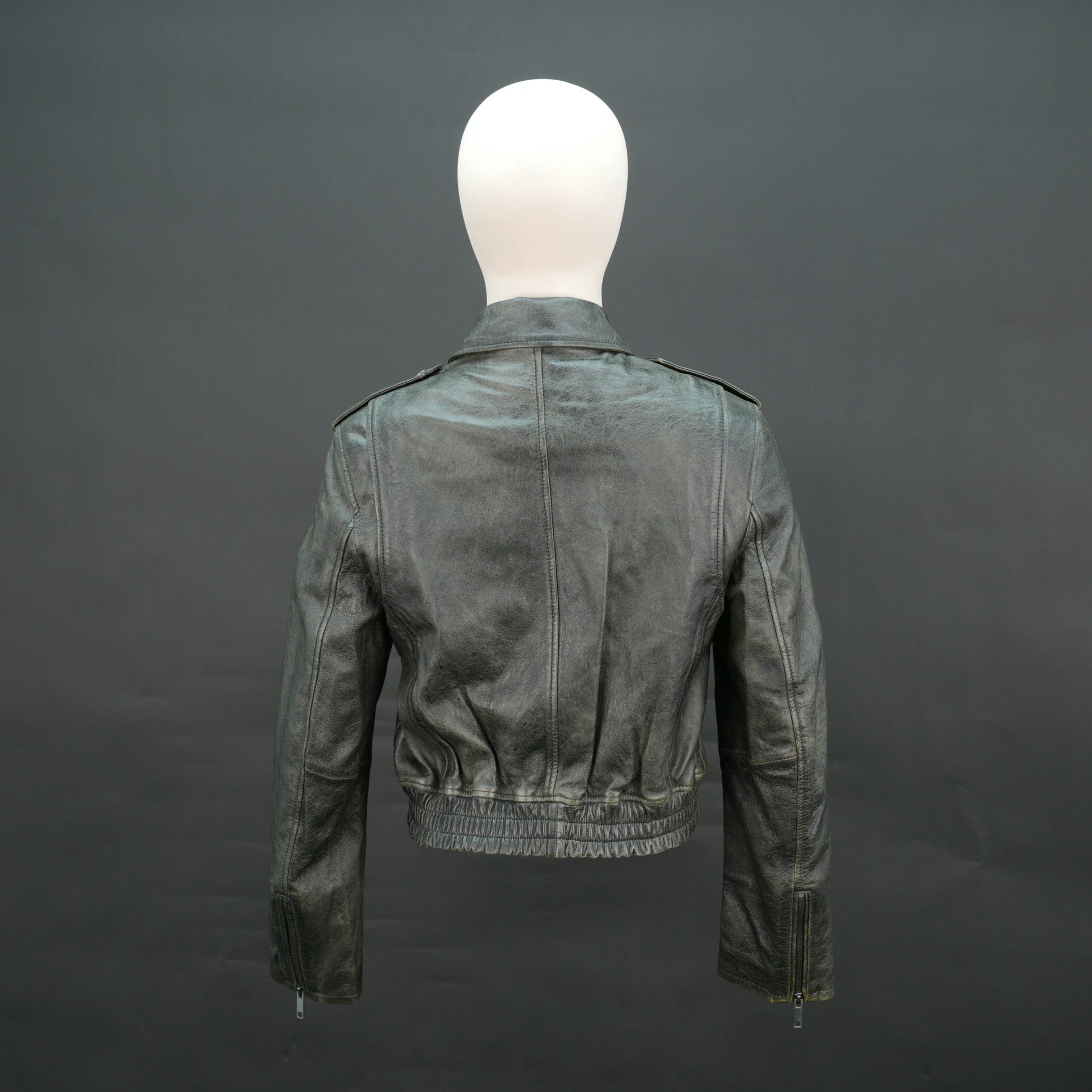 Grey distressed leather biker jacket with slim fit and lapel collar.
