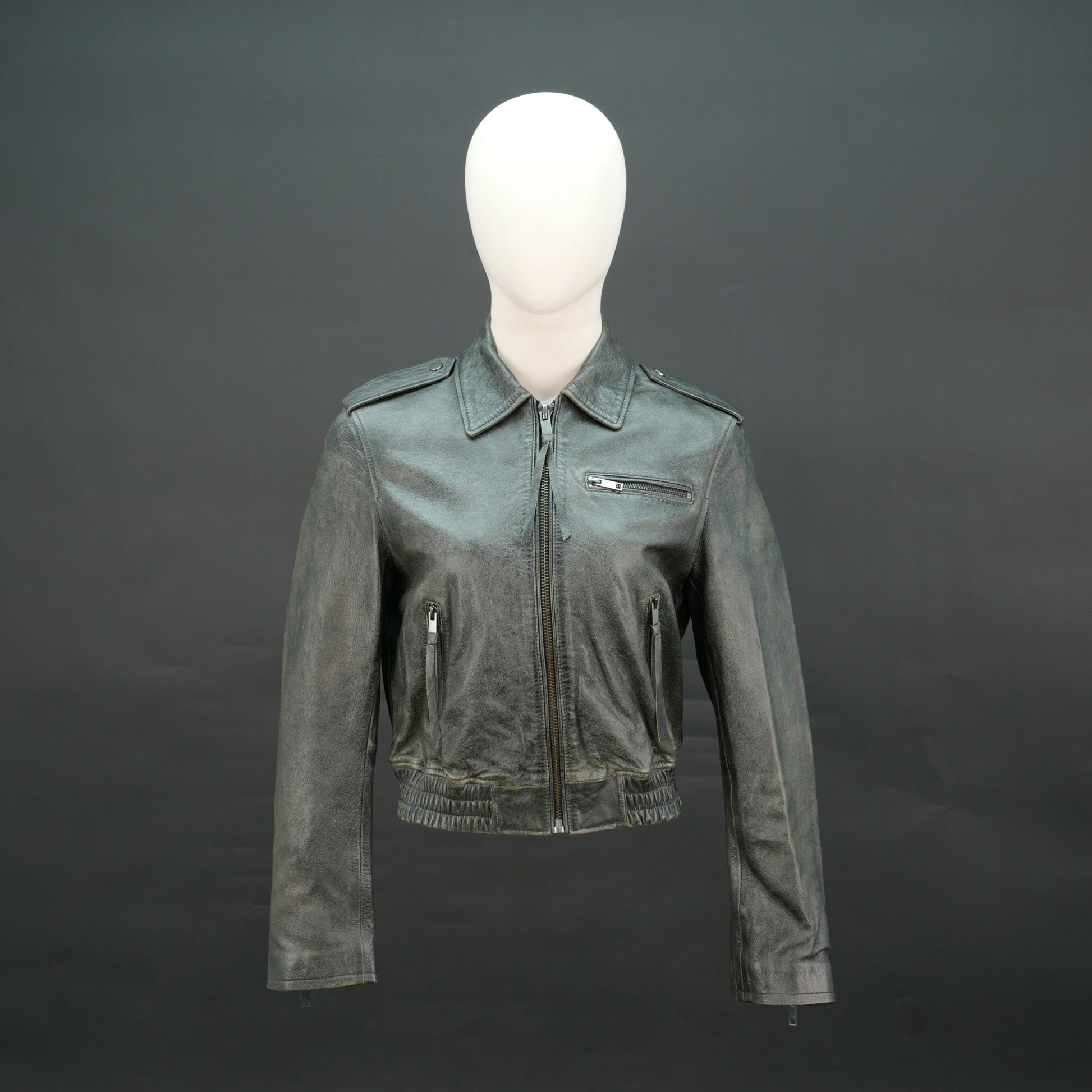 Grey distressed leather biker jacket with slim fit and lapel collar.