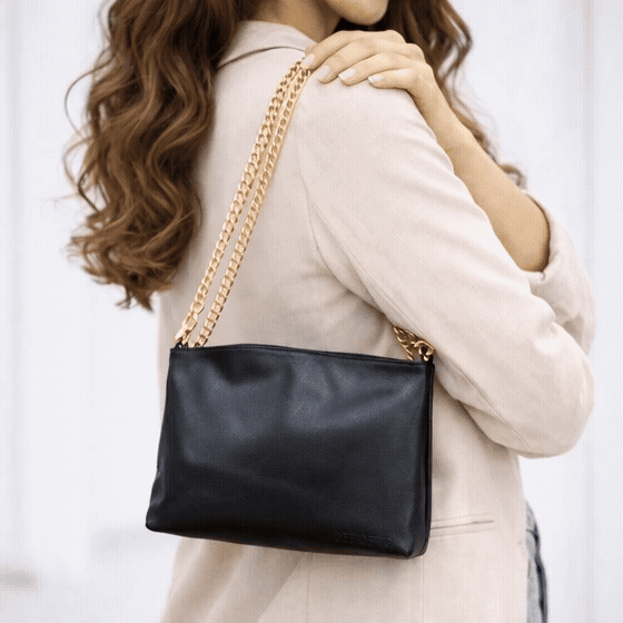 Leather bag with main compartment, two cash pockets, and a zip pocket, crafted for everyday elegance