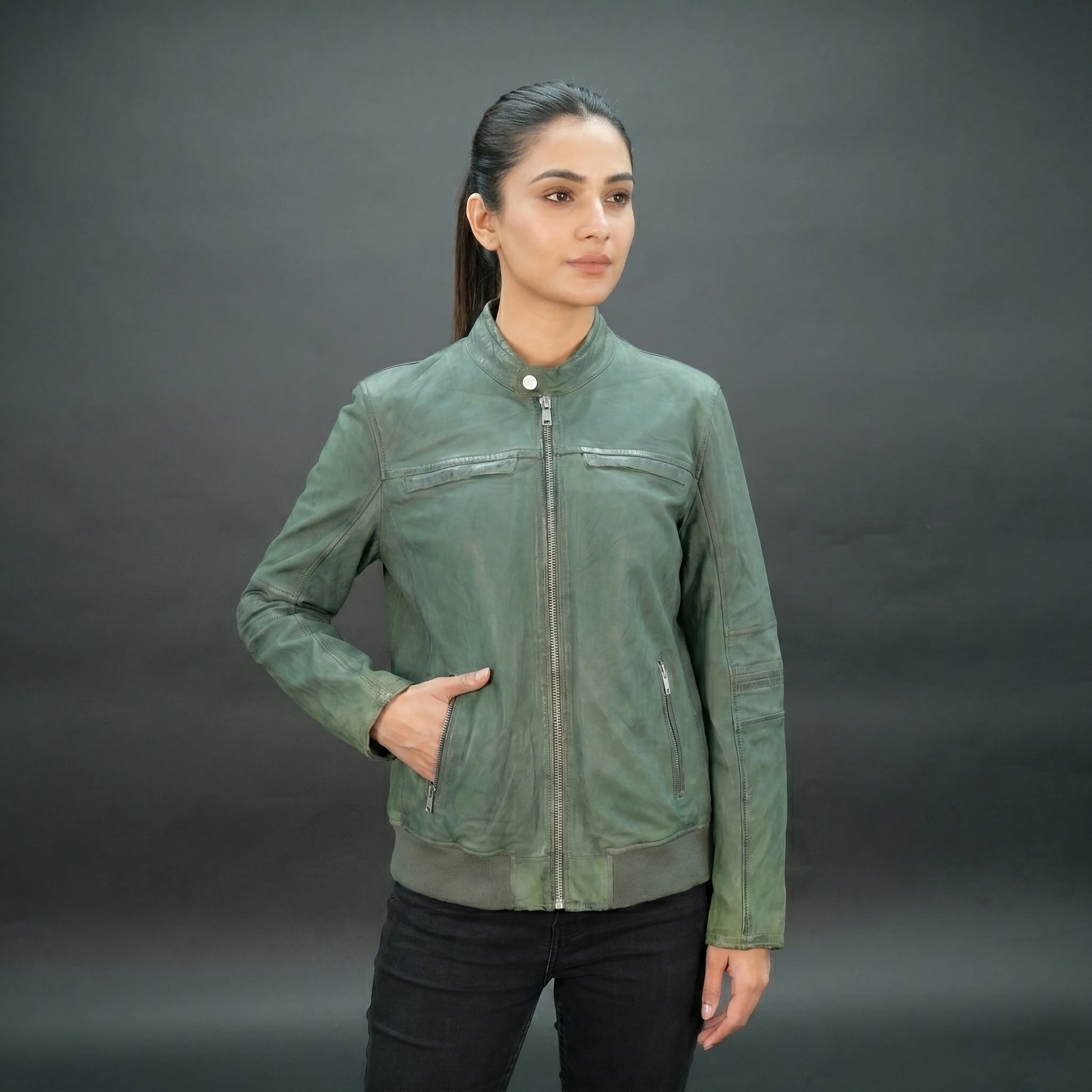 Green leather jacket with mandarin collar, zip closure, and slim fit.