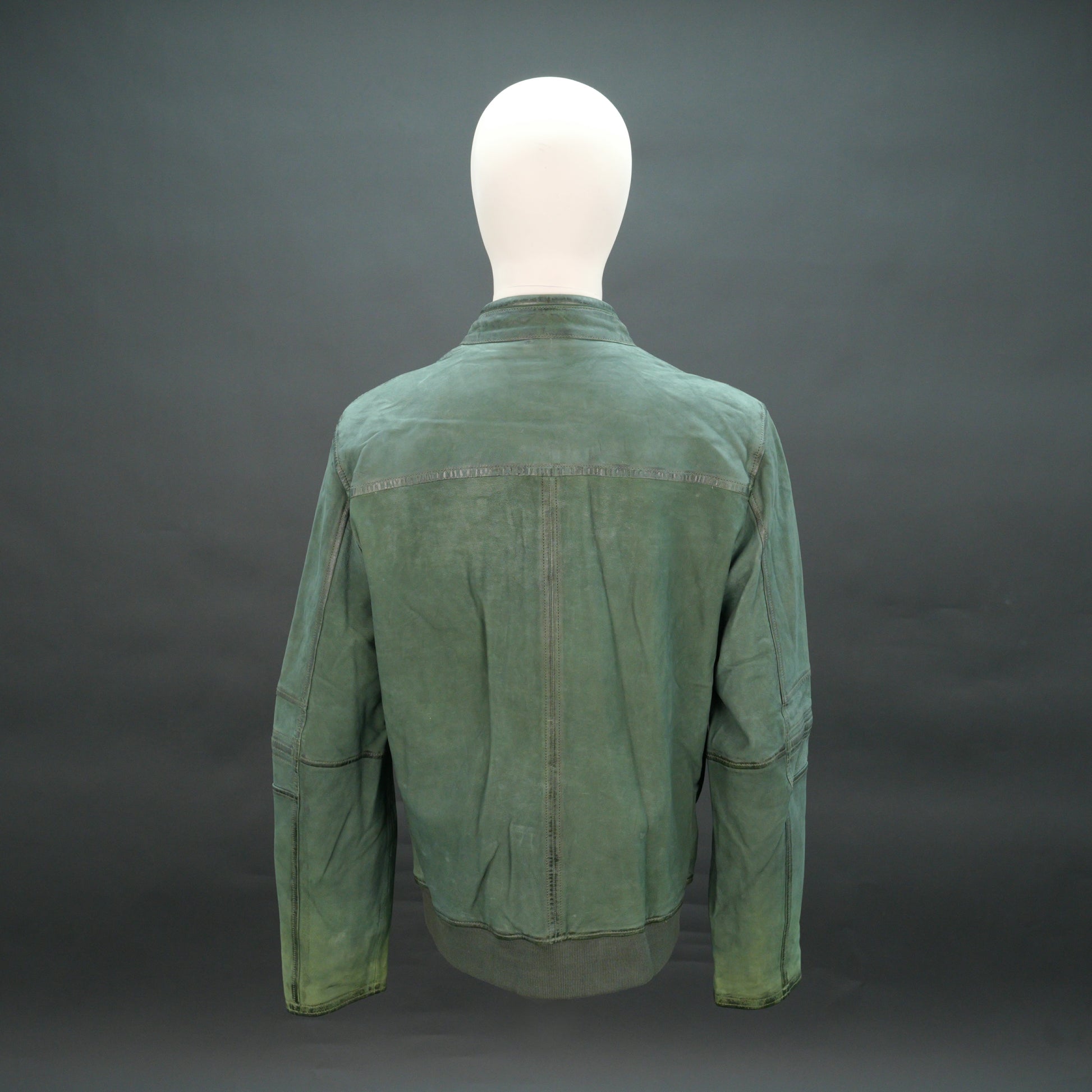 Green leather jacket with mandarin collar, zip closure, and slim fit.