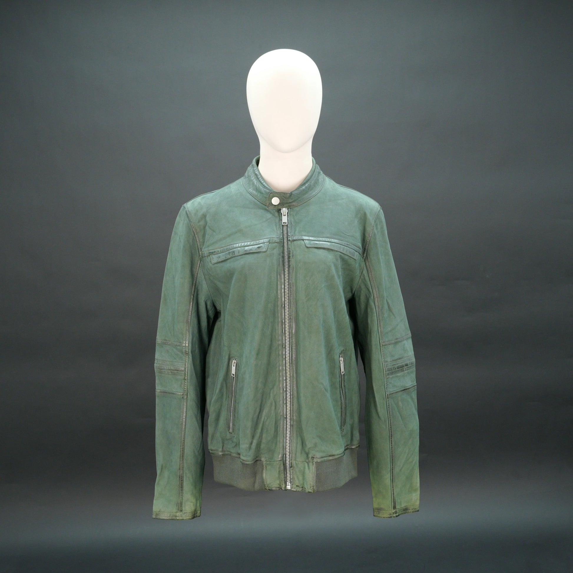 Green leather jacket with mandarin collar, zip closure, and slim fit.