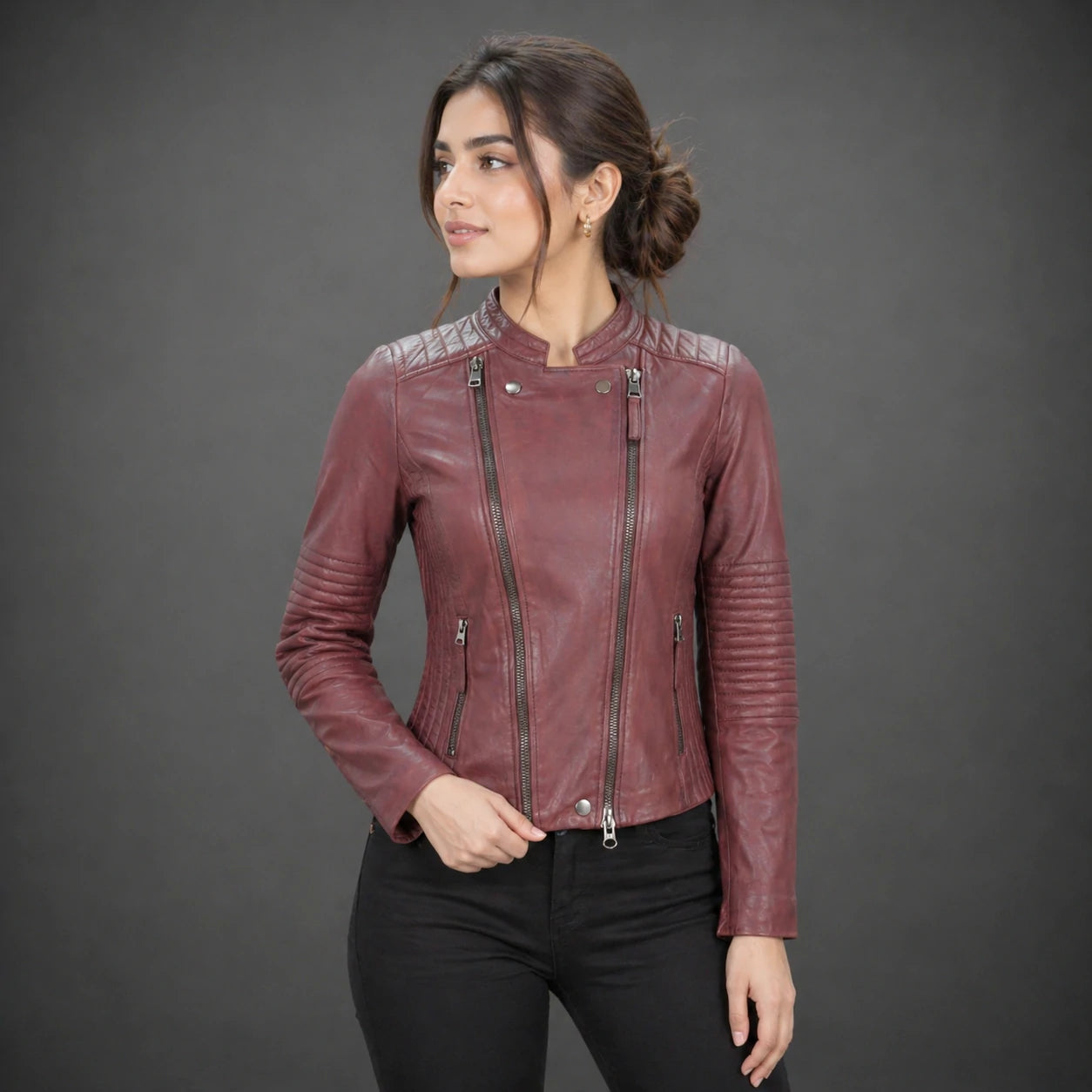 Women maroon leather biker jacket with quilted shoulders and front zip.