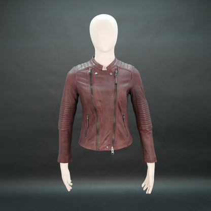 Women maroon leather biker jacket with quilted shoulders and front zip.