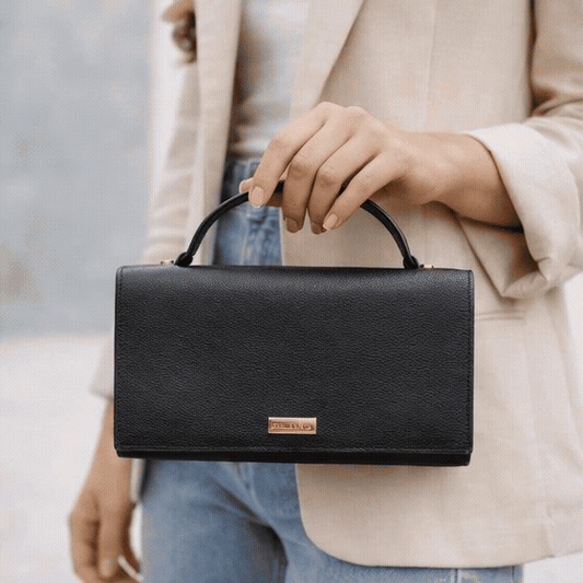Leather grab handle bag with two open pockets, durable construction, and versatile design for everyday use