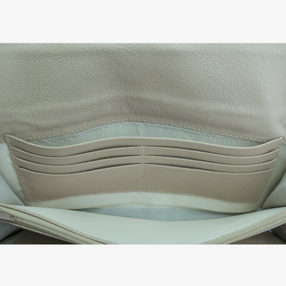 Beige leather clutch with three compartments, sixteen card slots, one zip pocket, cash compartment, and key for security