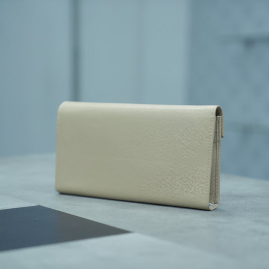 Beige leather clutch with three compartments, sixteen card slots, one zip pocket, cash compartment, and key for security