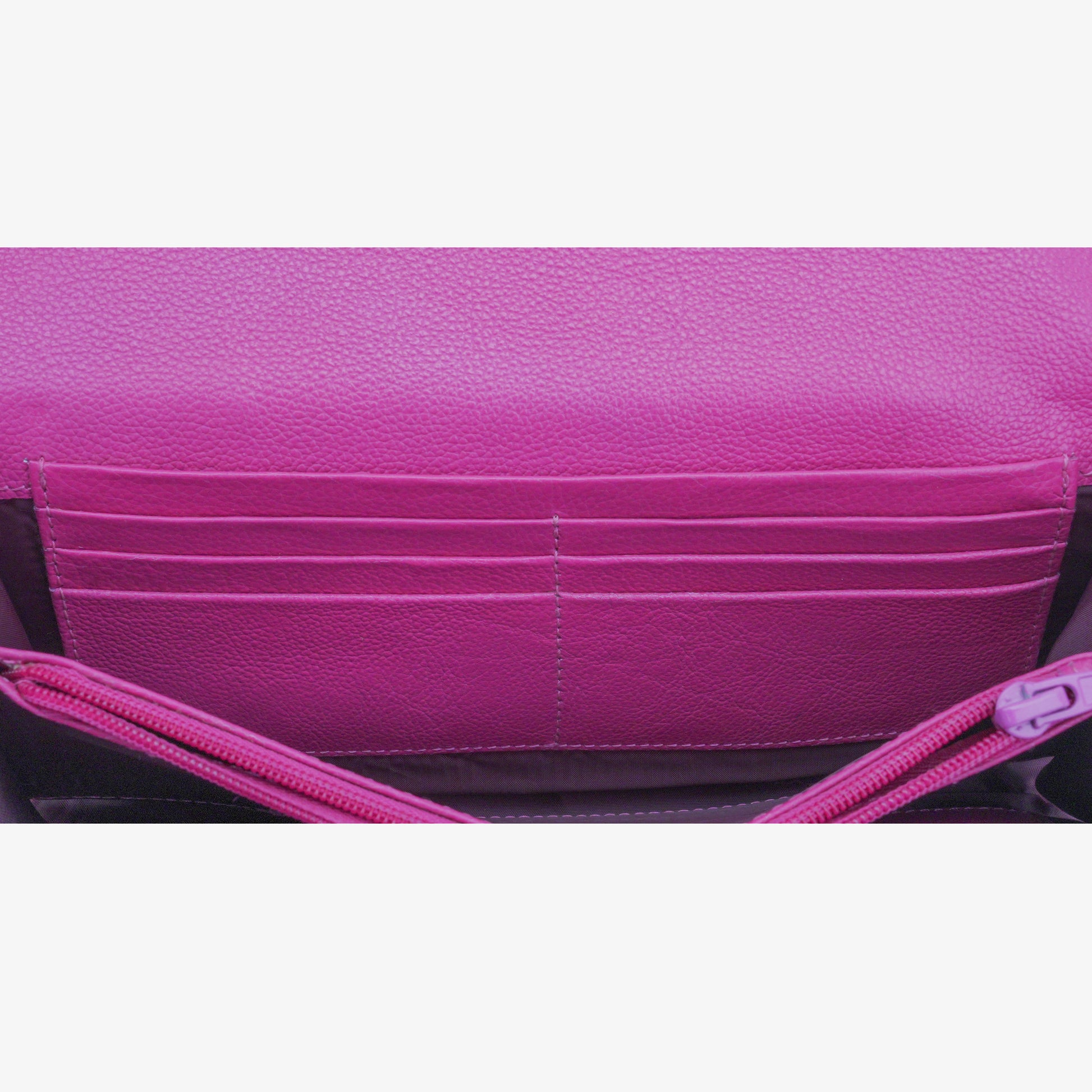 Pink leather clutch with three compartments, sixteen card slots, a zip pocket, cash compartment, and key for security