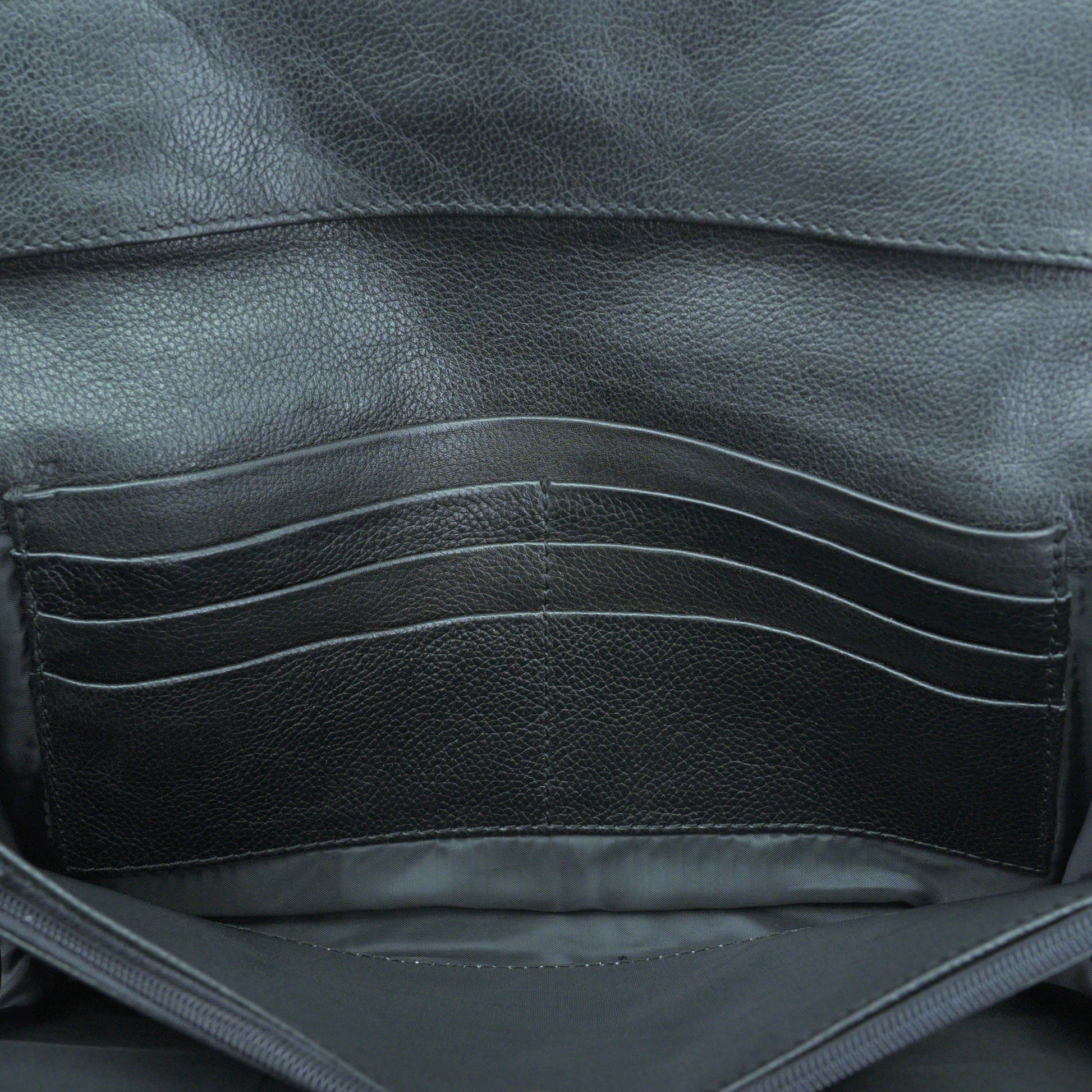Black leather mini clutch with three compartments, sixteen card slots, and zip pocket, compact and elegant