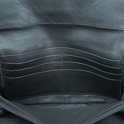 Black leather mini clutch with three compartments, sixteen card slots, and zip pocket, compact and elegant