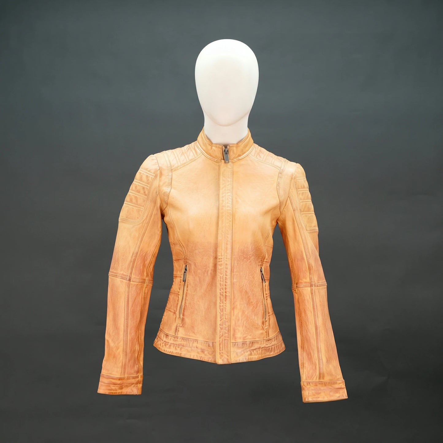 Tan distressed leather biker jacket with stand-up zip collar and quilted detailing.
