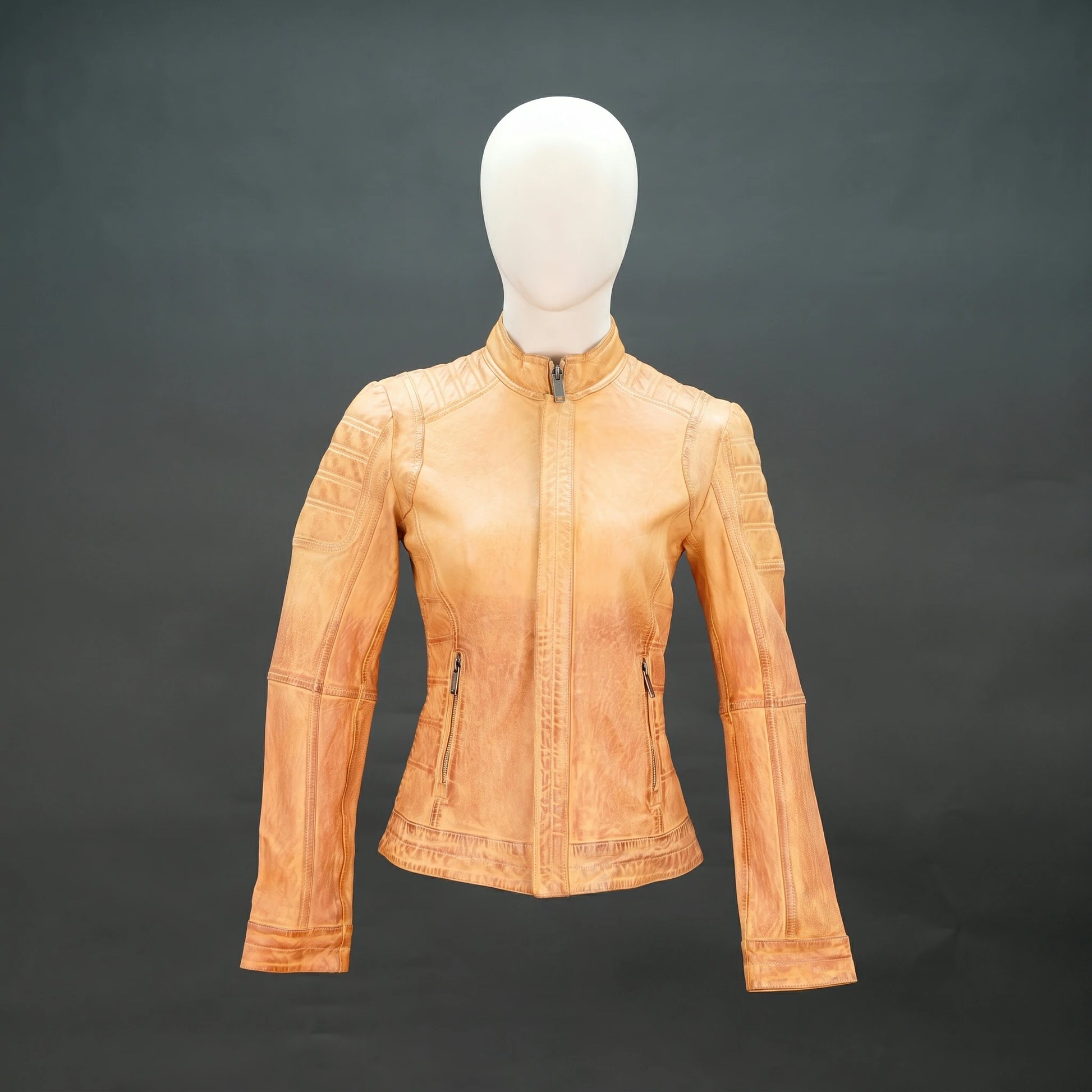 Tan distressed leather biker jacket with stand-up zip collar and quilted detailing.