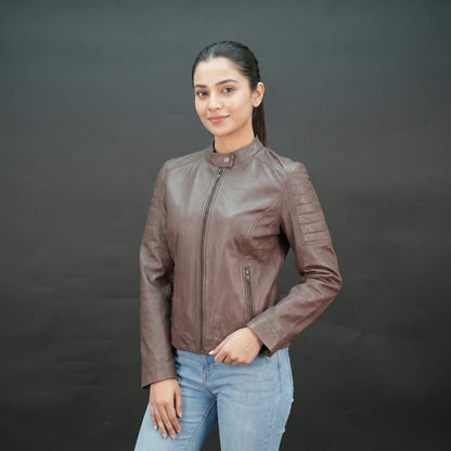Brown leather biker jacket with quilted shoulders and slim fit design.