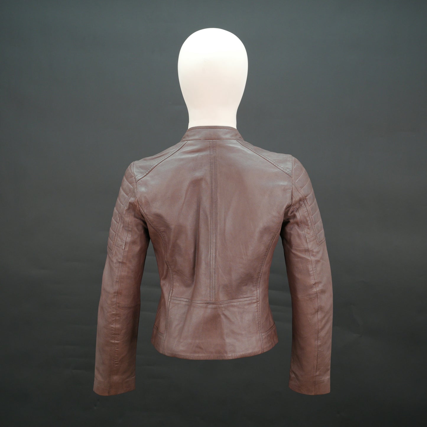 Brown leather biker jacket with quilted shoulders and slim fit design.