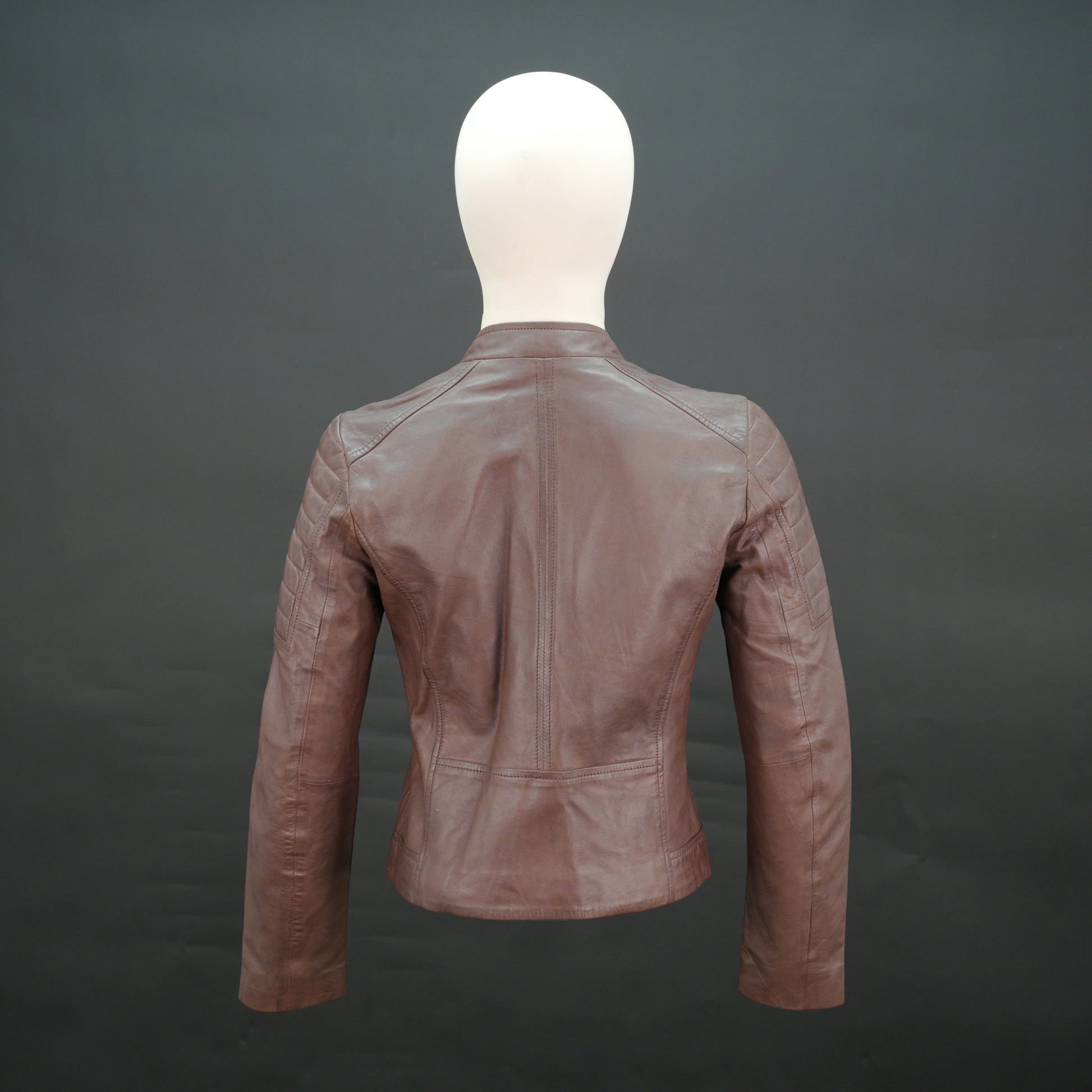 Brown leather biker jacket with quilted shoulders and slim fit design.