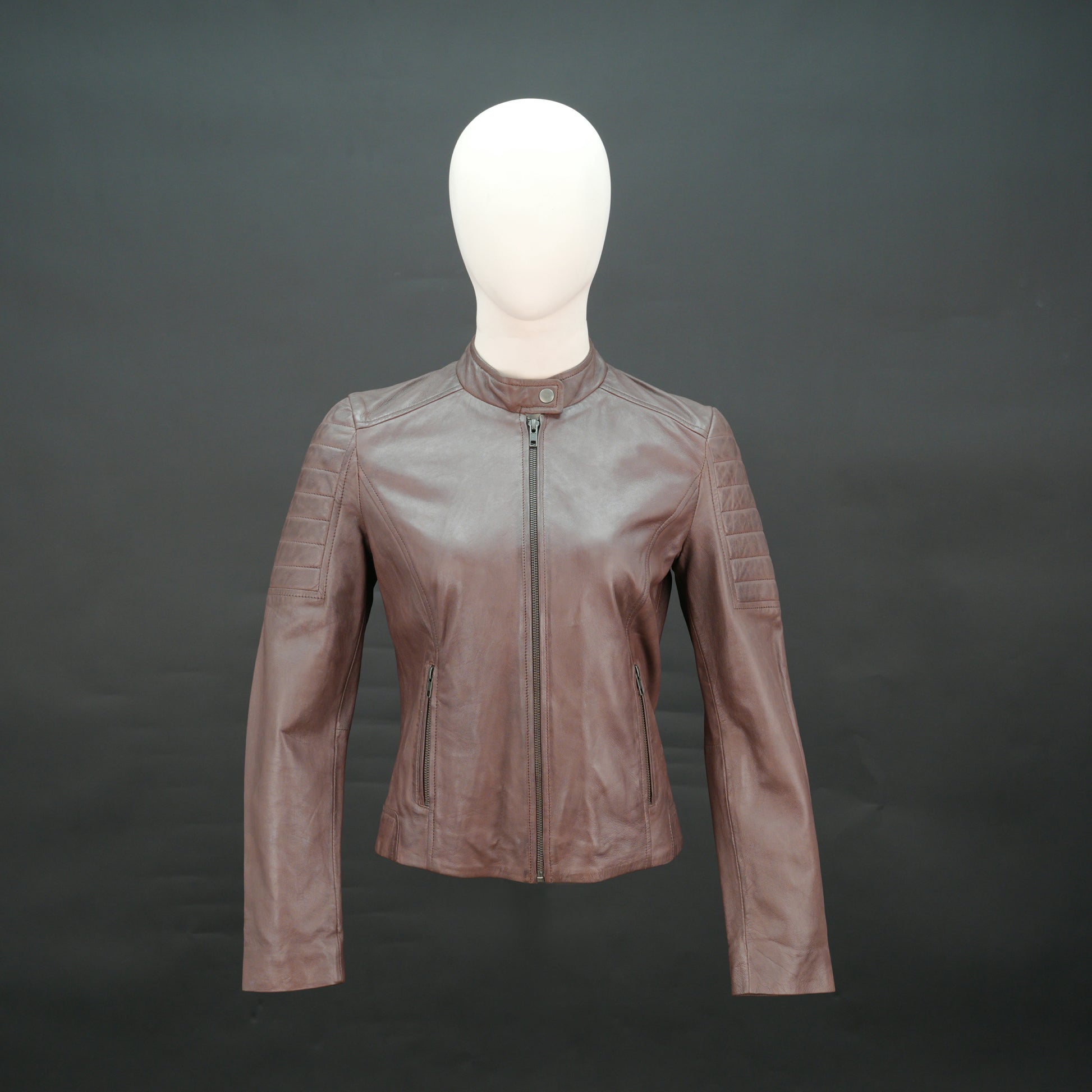Brown leather biker jacket with quilted shoulders and slim fit design.