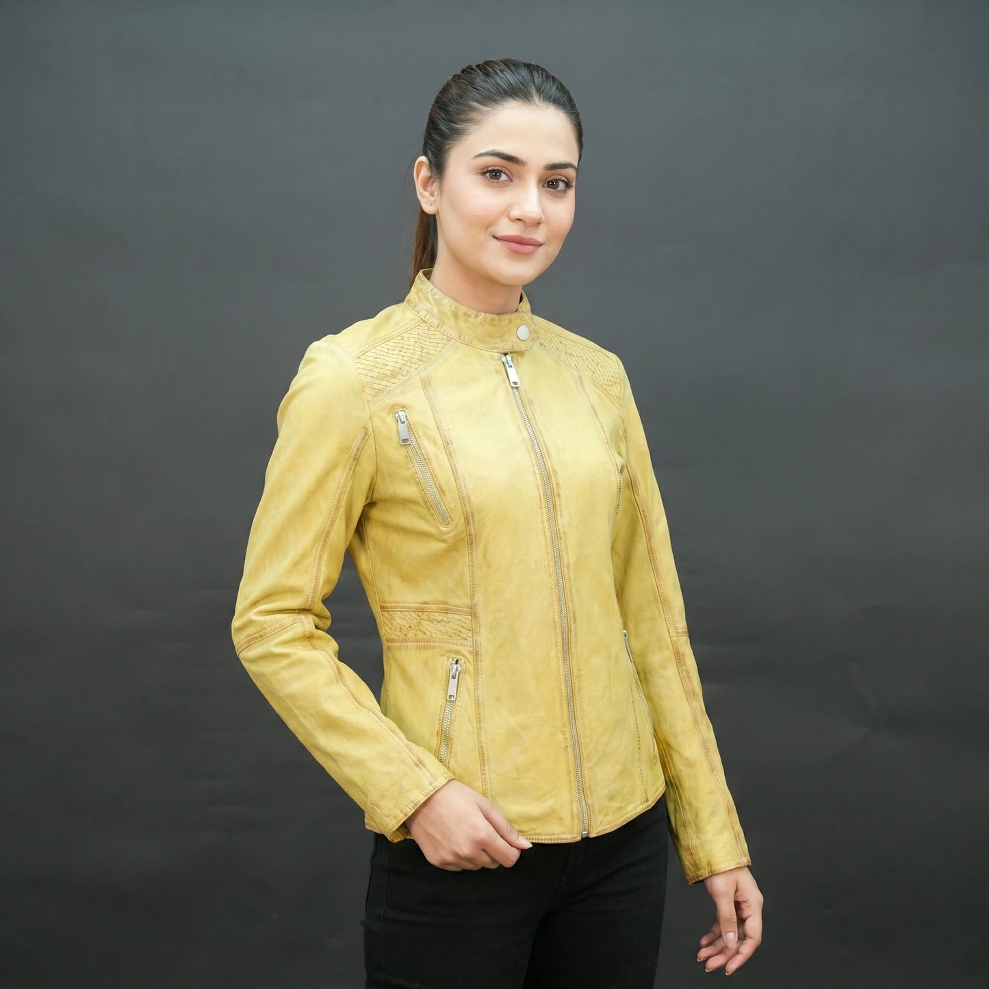 Mustard yellow leather biker jacket with asymmetrical zip.