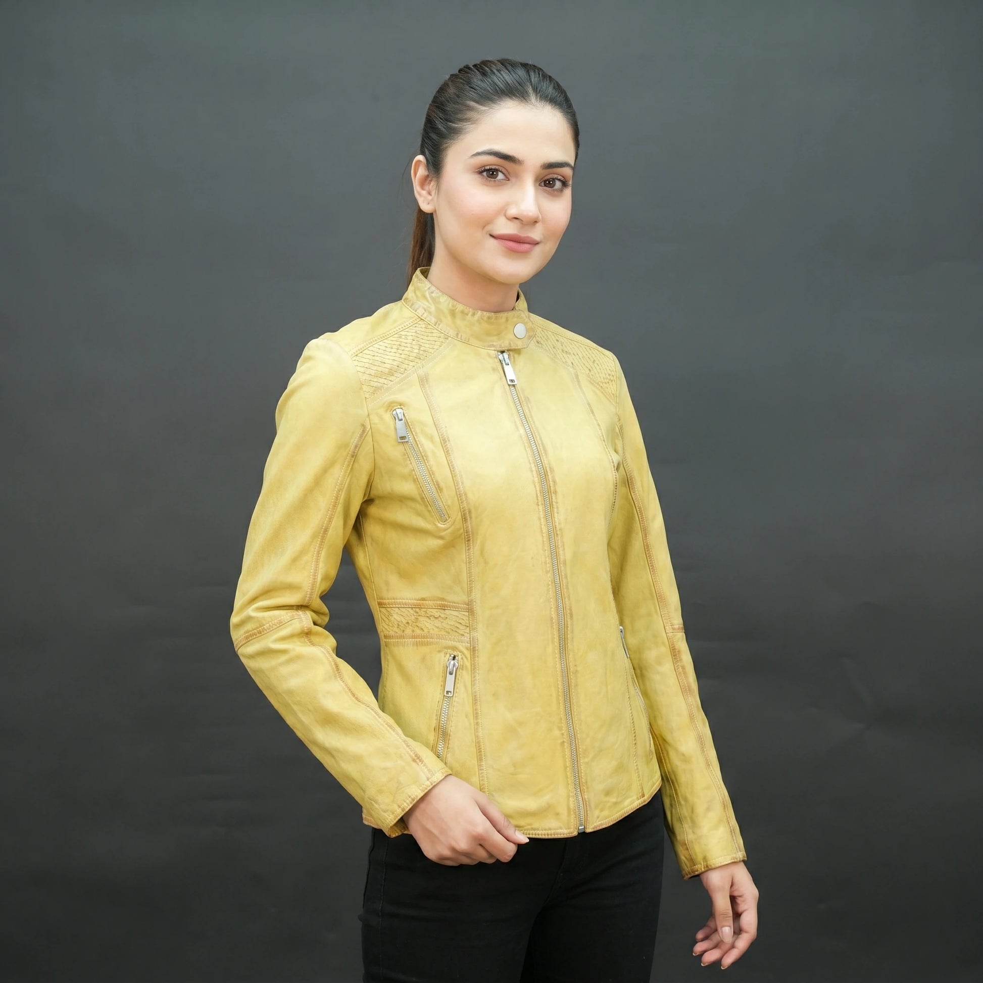 Mustard yellow leather biker jacket with asymmetrical zip.