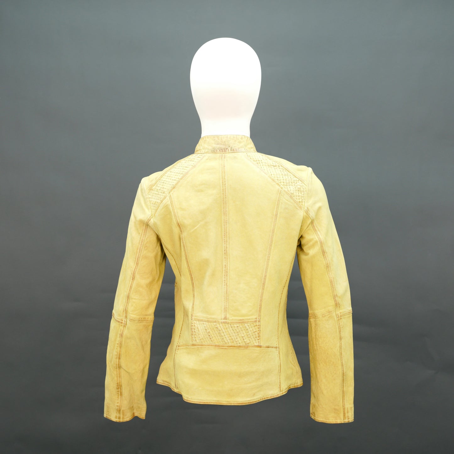 Mustard yellow leather biker jacket with asymmetrical zip.