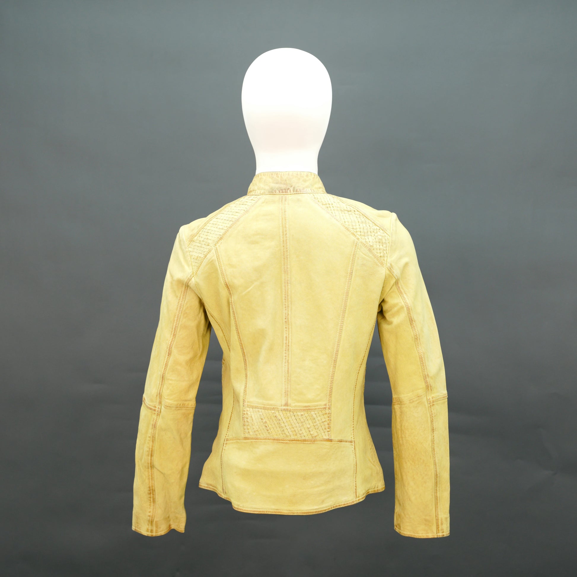 Mustard yellow leather biker jacket with asymmetrical zip.