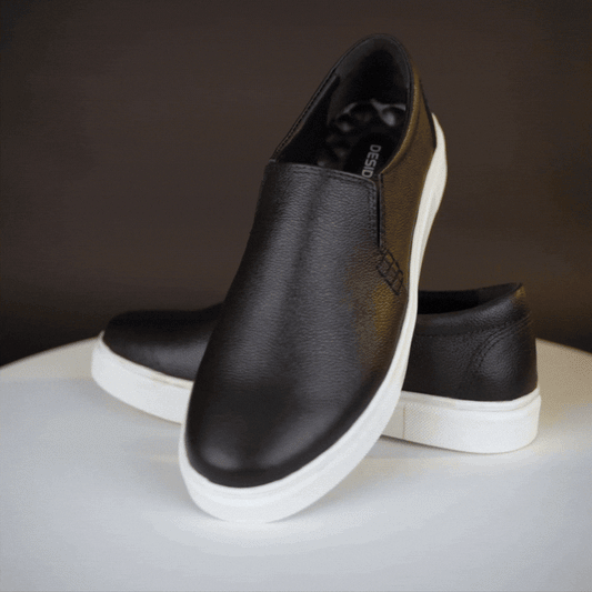 Stylish slip-on sneakers in premium Cow Chelsia leather with soft sheep leather lining, non-woven insole, and durable TPR sole in black—comfortable, flexible, and suitable for both formal and casual occasions.