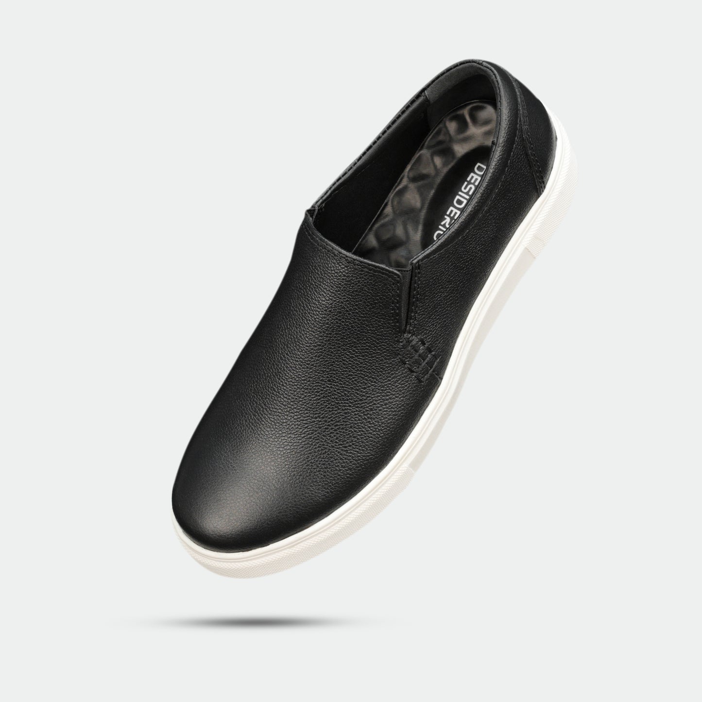 Black slip-on sneakers (Minor Fault) crafted from premium Cow Chelsia leather with soft sheep leather lining, non-woven insole, and durable TPR sole—comfortable, flexible, and ideal for both formal and casual occasions.