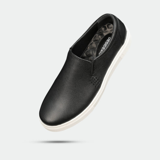 Black slip-on sneakers (Minor Fault) crafted from premium Cow Chelsia leather with soft sheep leather lining, non-woven insole, and durable TPR sole—comfortable, flexible, and ideal for both formal and casual occasions.
