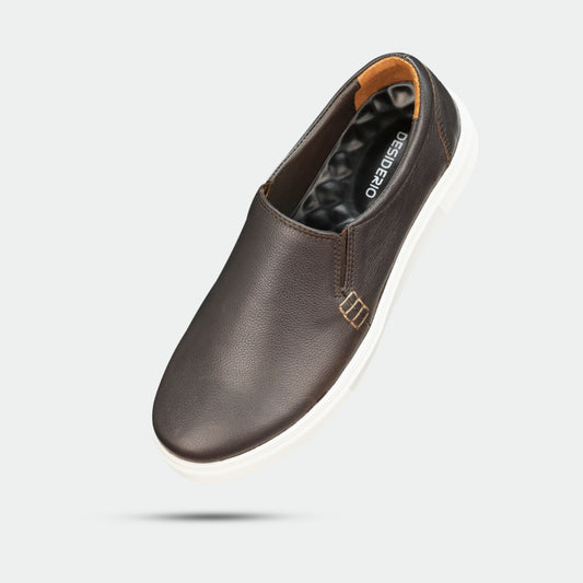 Stylish slip-on sneakers in premium Cow Chelsia leather with soft sheep leather lining, non-woven insole, and durable TPR sole in black-brown—comfortable, flexible, and suitable for both formal and casual wear.