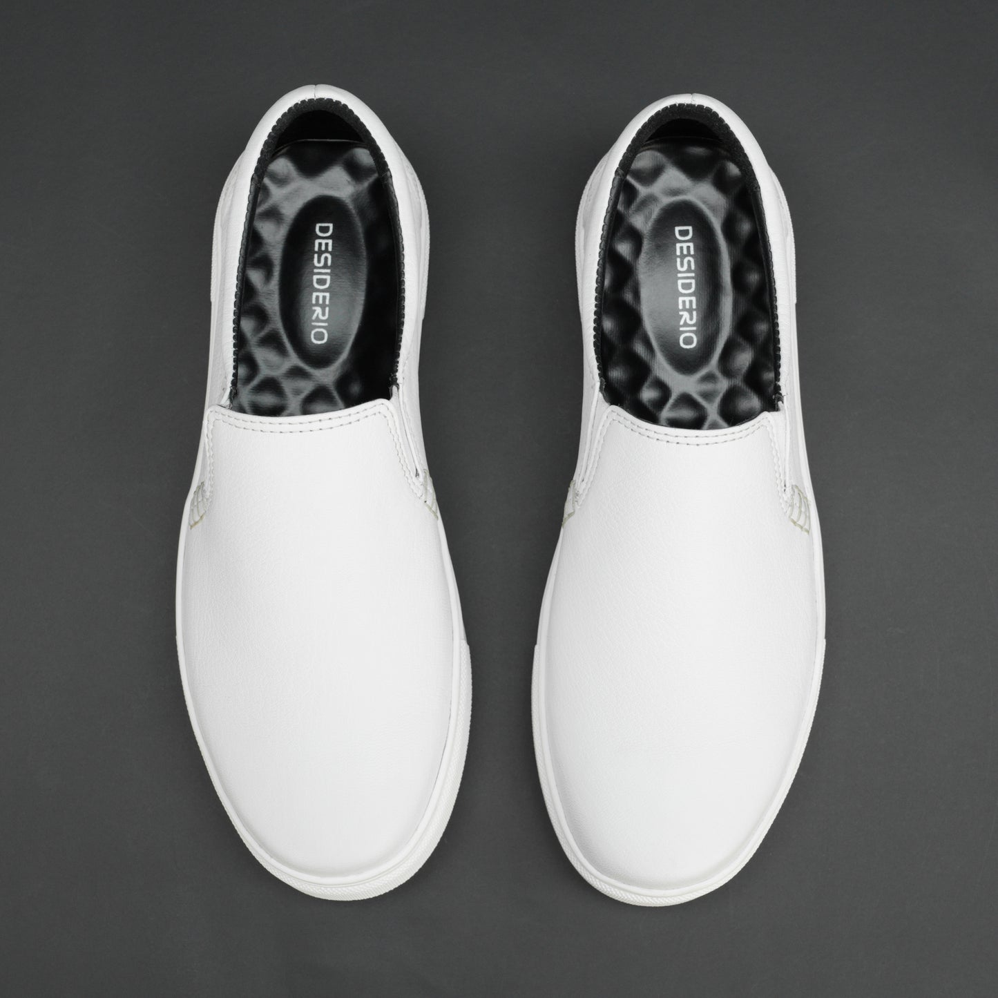 White slip-on sneakers crafted from premium Cow Chelsia leather with soft sheep leather lining, non-woven insole, and durable TPR sole—comfortable, flexible, and suitable for both formal and casual occasions.